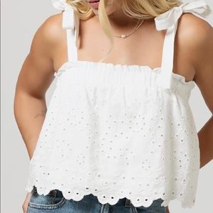 White eyelet tank with shoulder ties. Size large. From store “Latest Scoop”.
